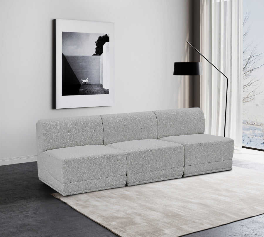 Canapé trois places sans accoudoirs en tissu Boucle Ollie