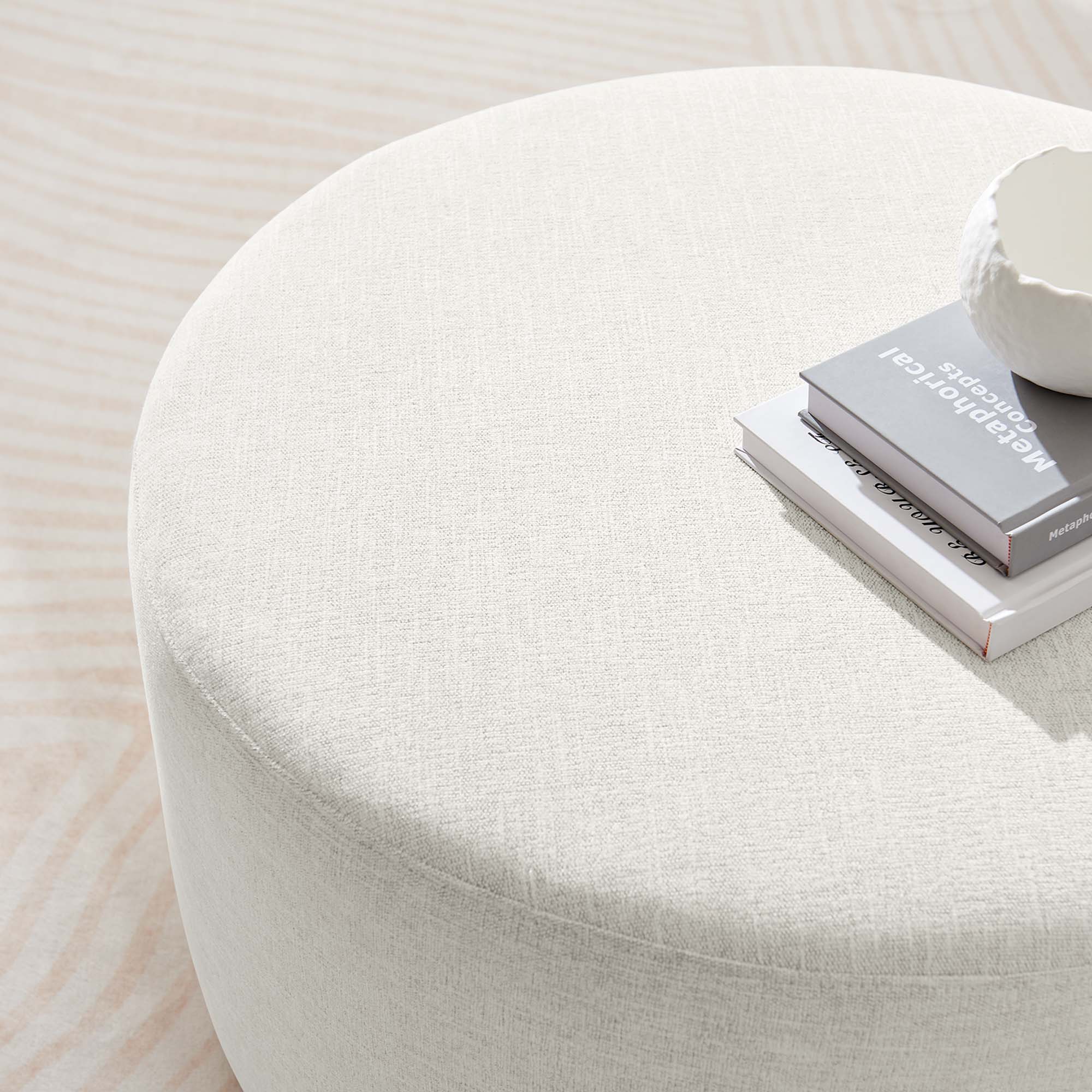 Callum Large Round Woven Heathered Fabric Upholstered Ottoman