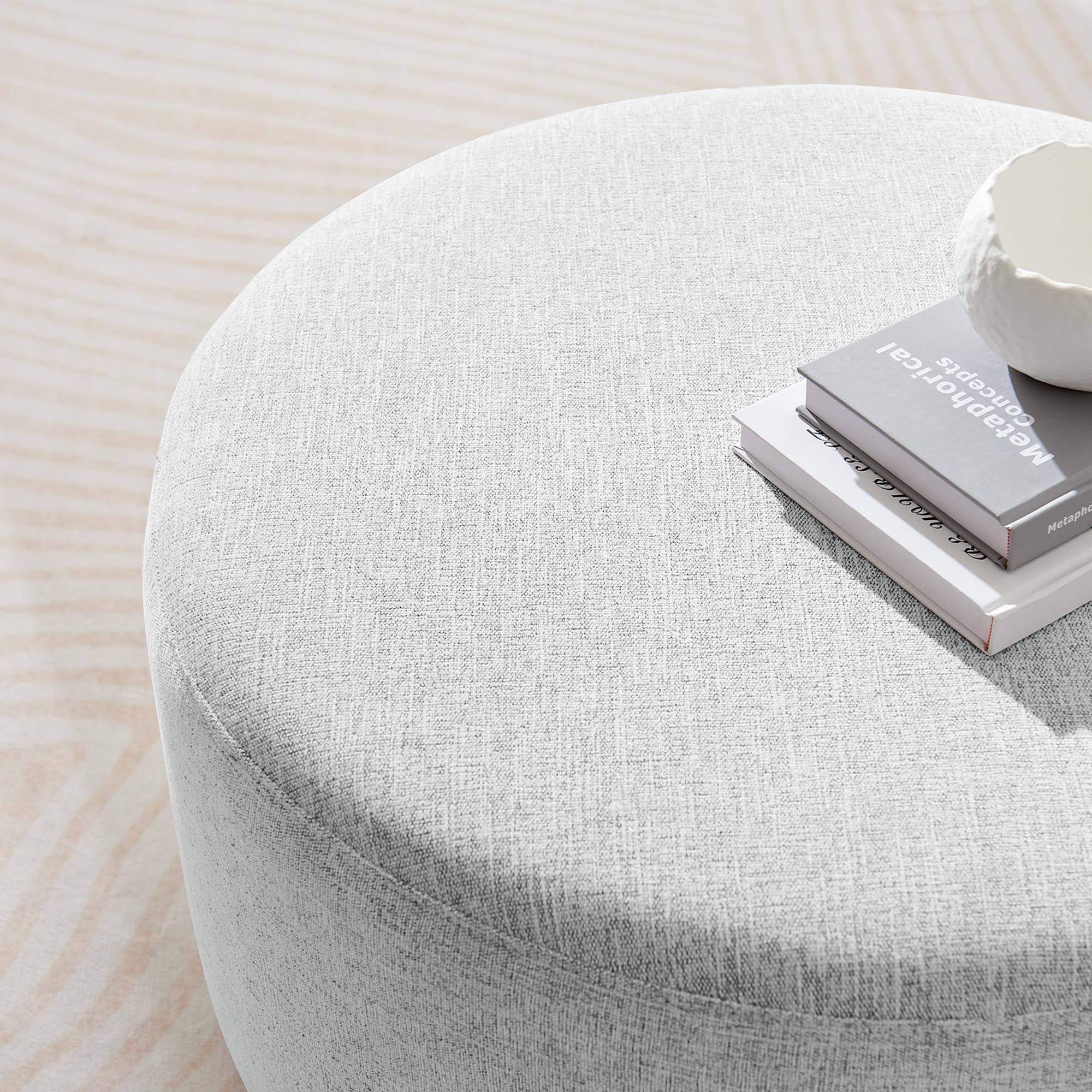 Callum Large Round Woven Heathered Fabric Upholstered Ottoman