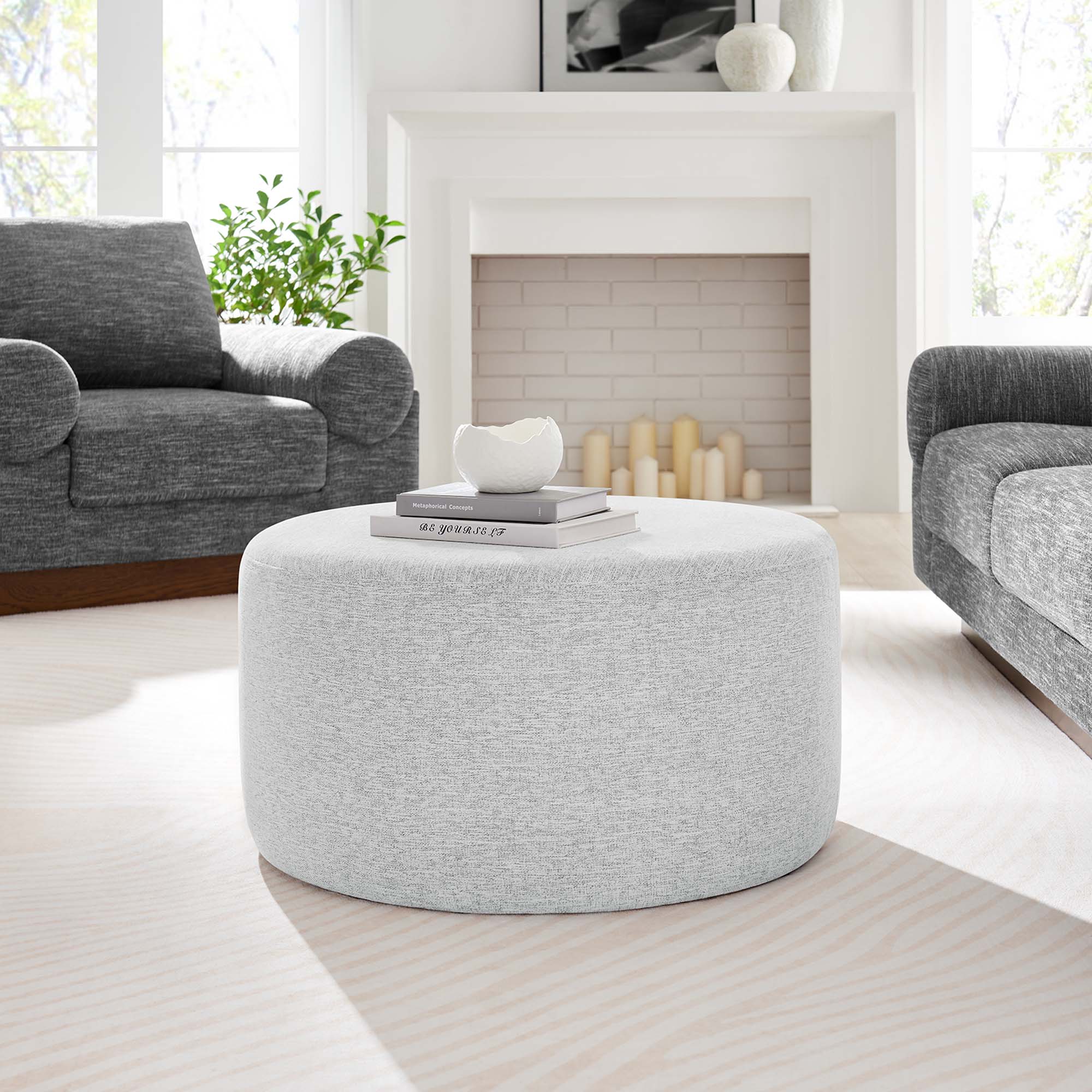 Callum Large Round Woven Heathered Fabric Upholstered Ottoman