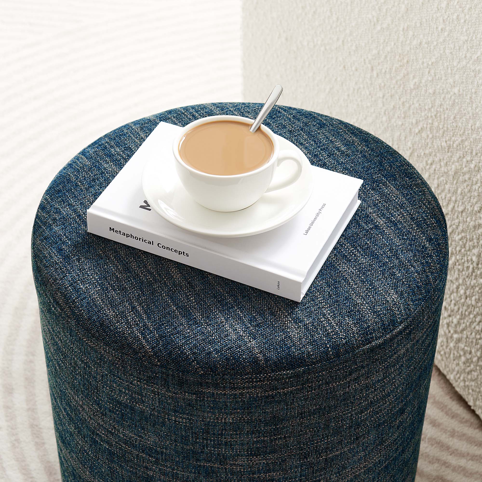 Callum Round Woven Heathered Fabric Upholstered Ottoman