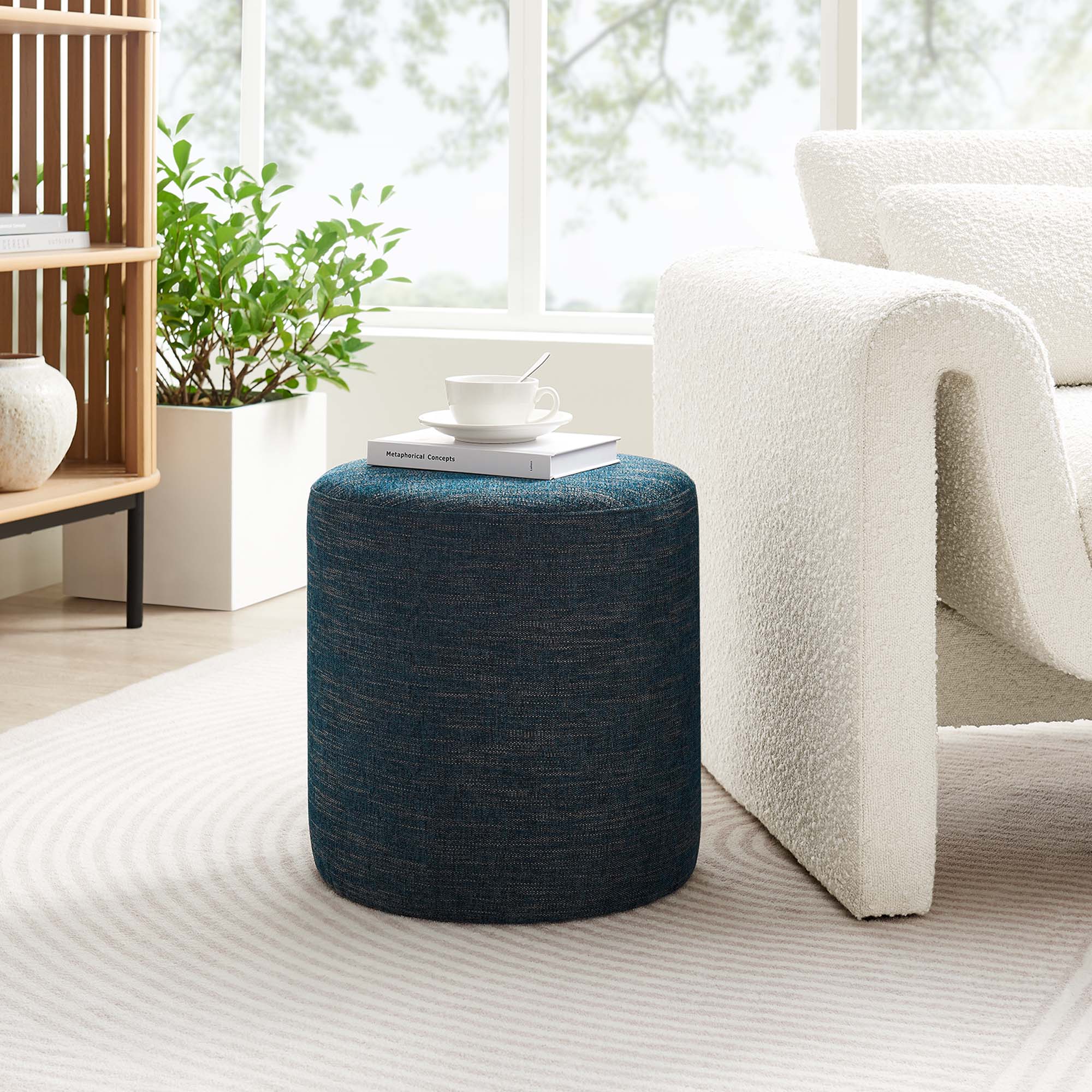 Callum Round Woven Heathered Fabric Upholstered Ottoman