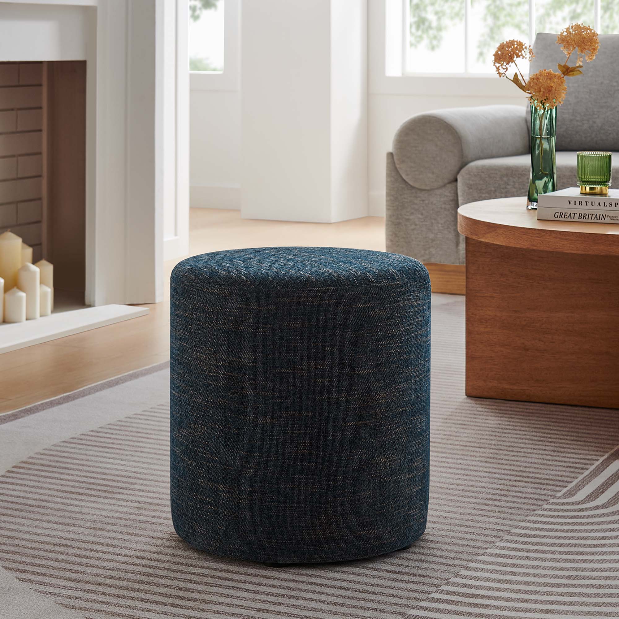 Callum Round Woven Heathered Fabric Upholstered Ottoman