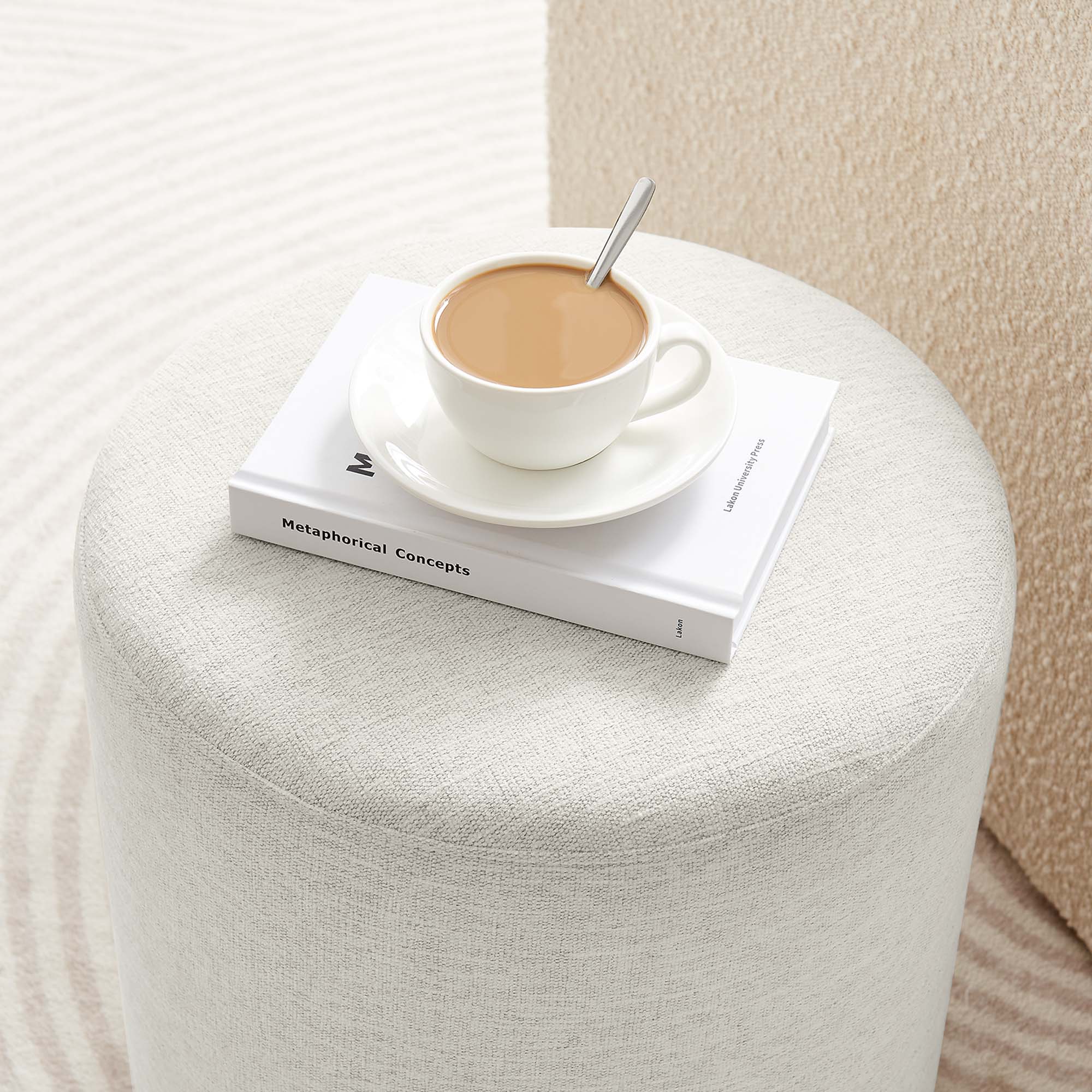 Callum Round Woven Heathered Fabric Upholstered Ottoman