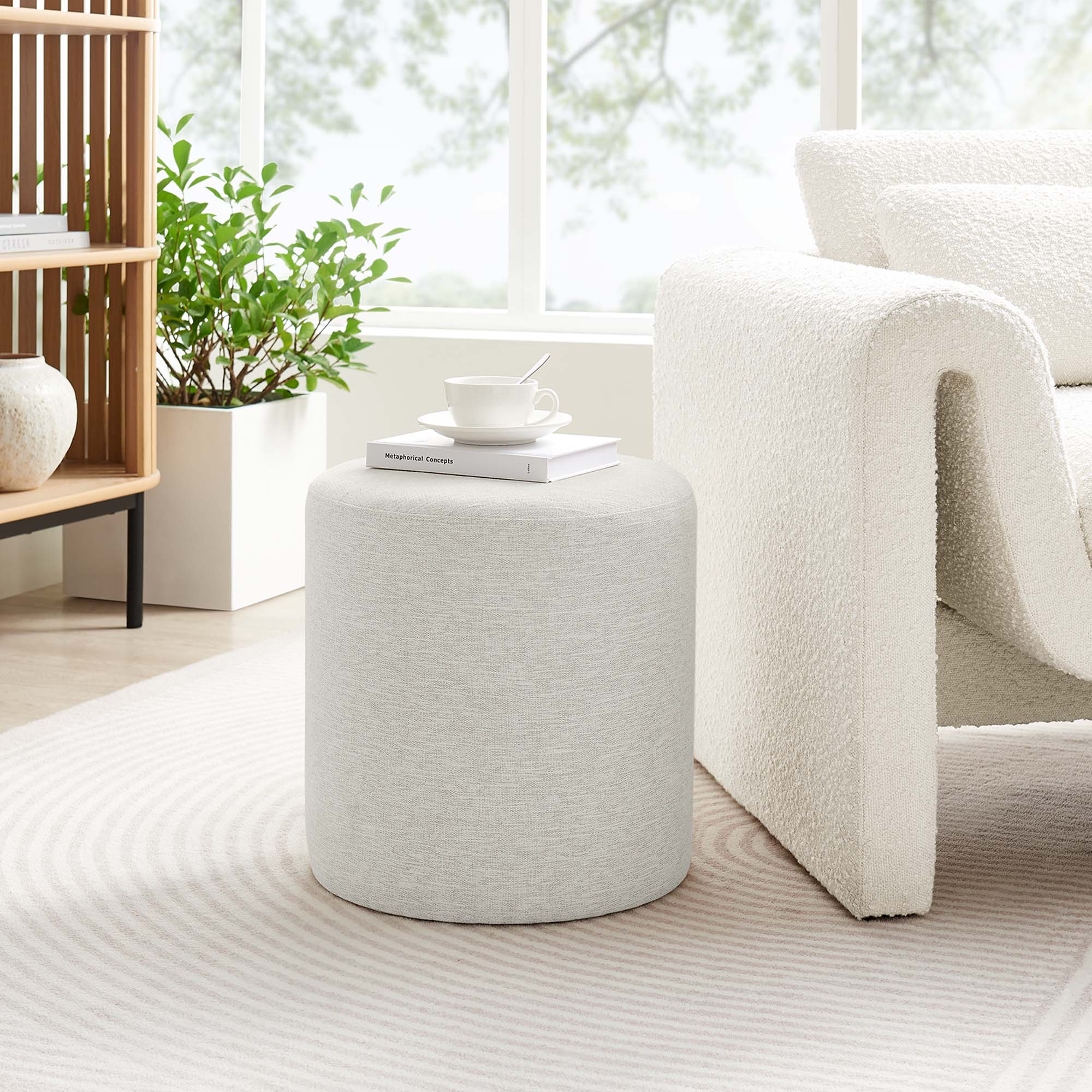 Callum Round Woven Heathered Fabric Upholstered Ottoman