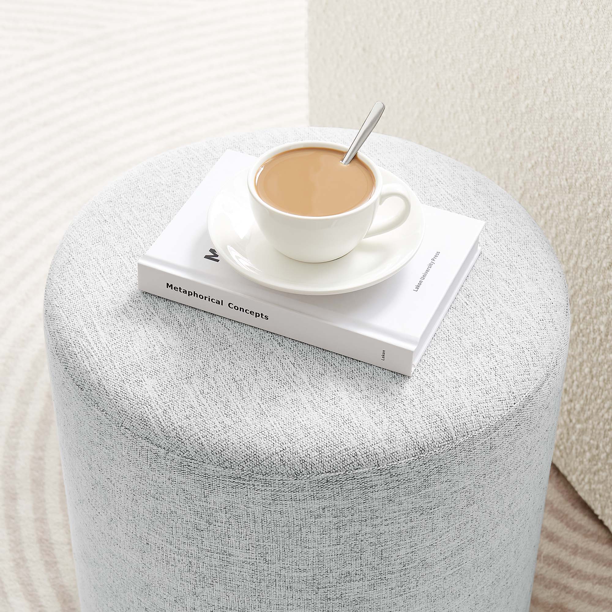 Callum Round Woven Heathered Fabric Upholstered Ottoman