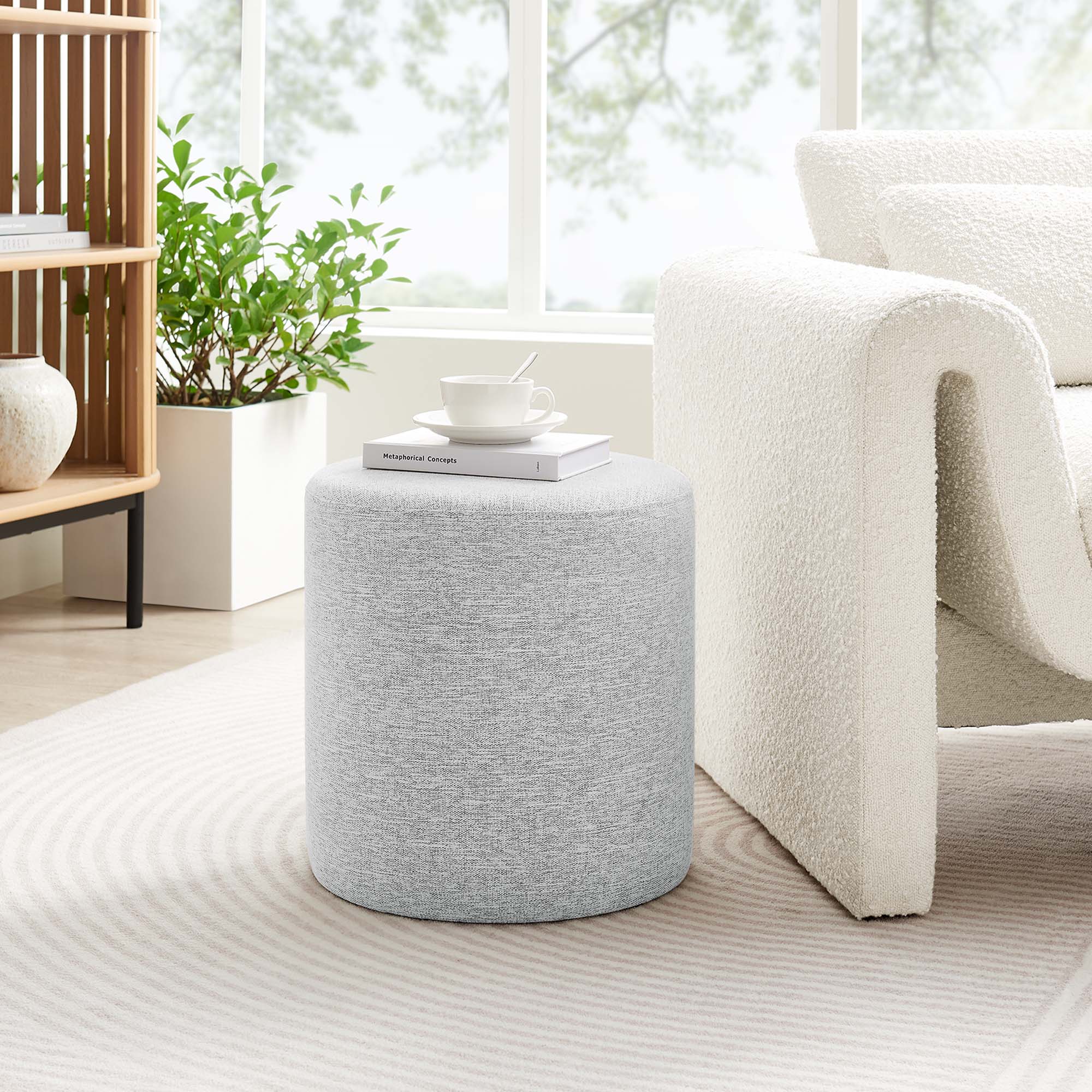 Callum Round Woven Heathered Fabric Upholstered Ottoman