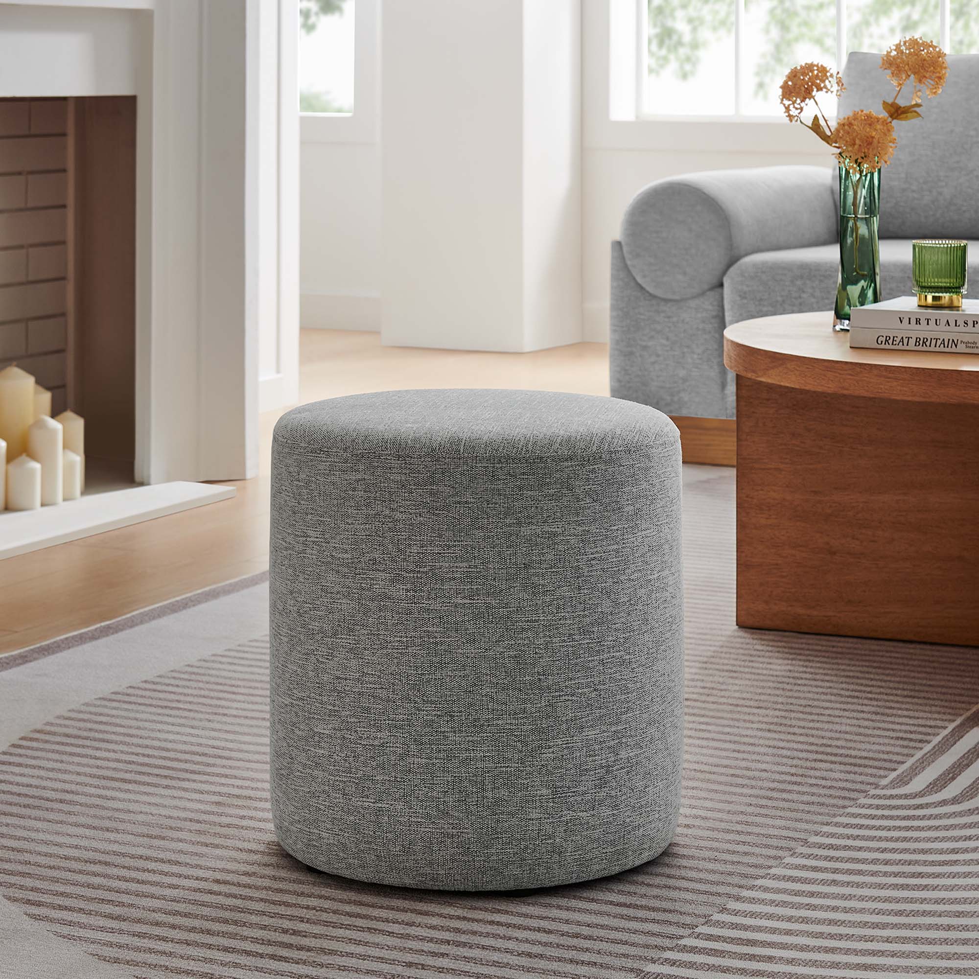 Callum Round Woven Heathered Fabric Upholstered Ottoman