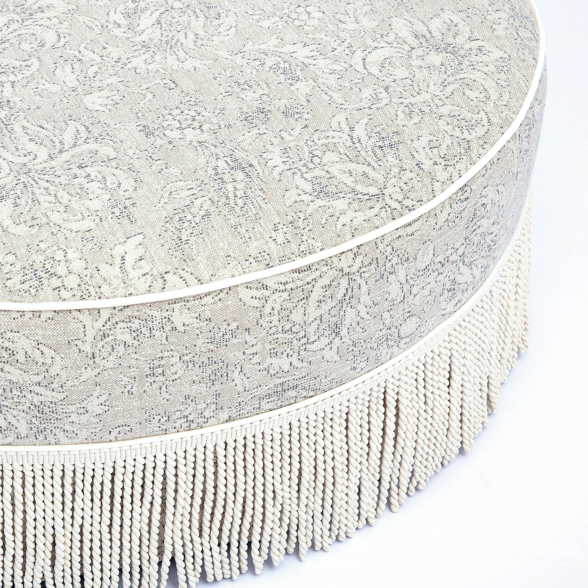 Tassy Tasseled Round Ottoman