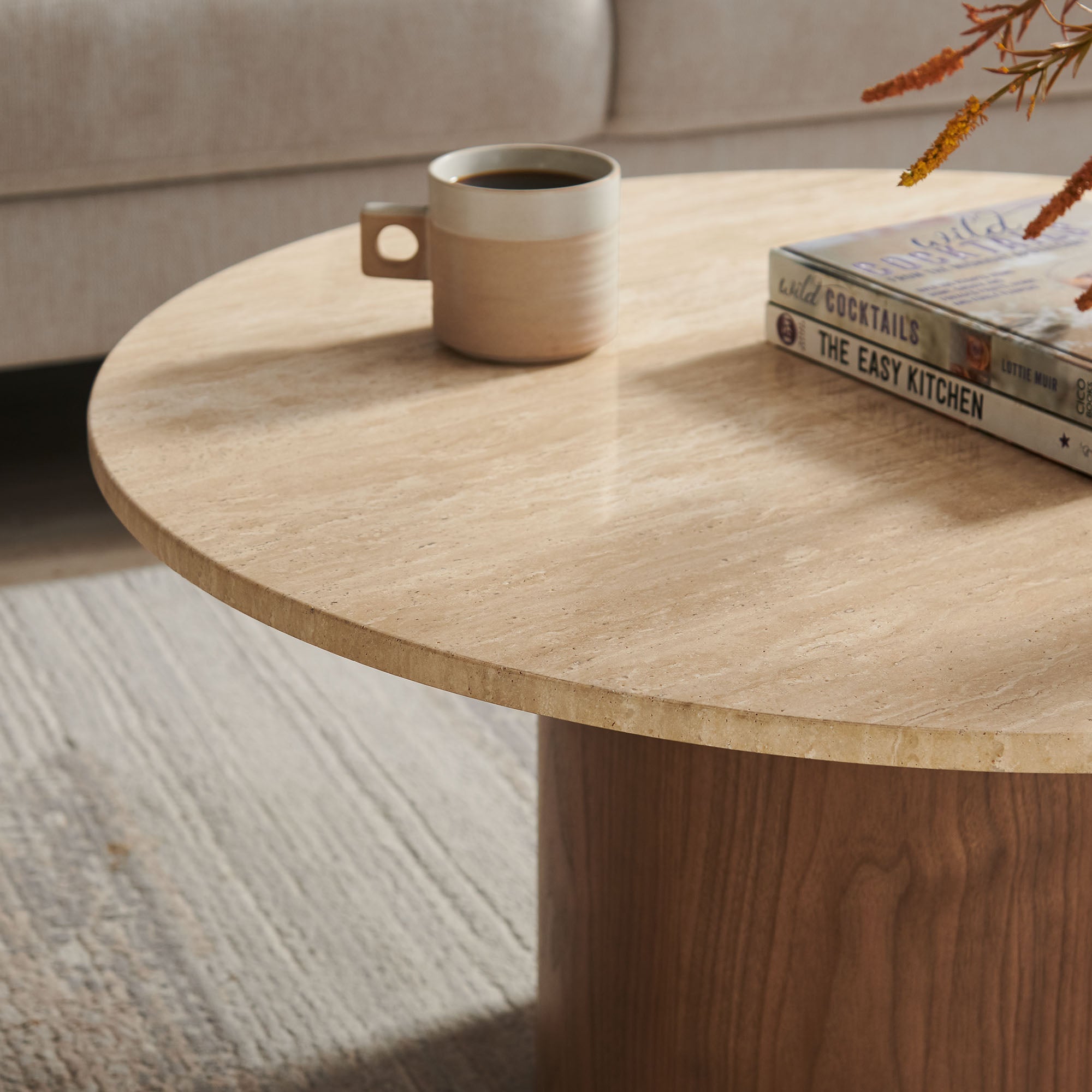 Kioni Round Travertine Coffee Table in Walnut